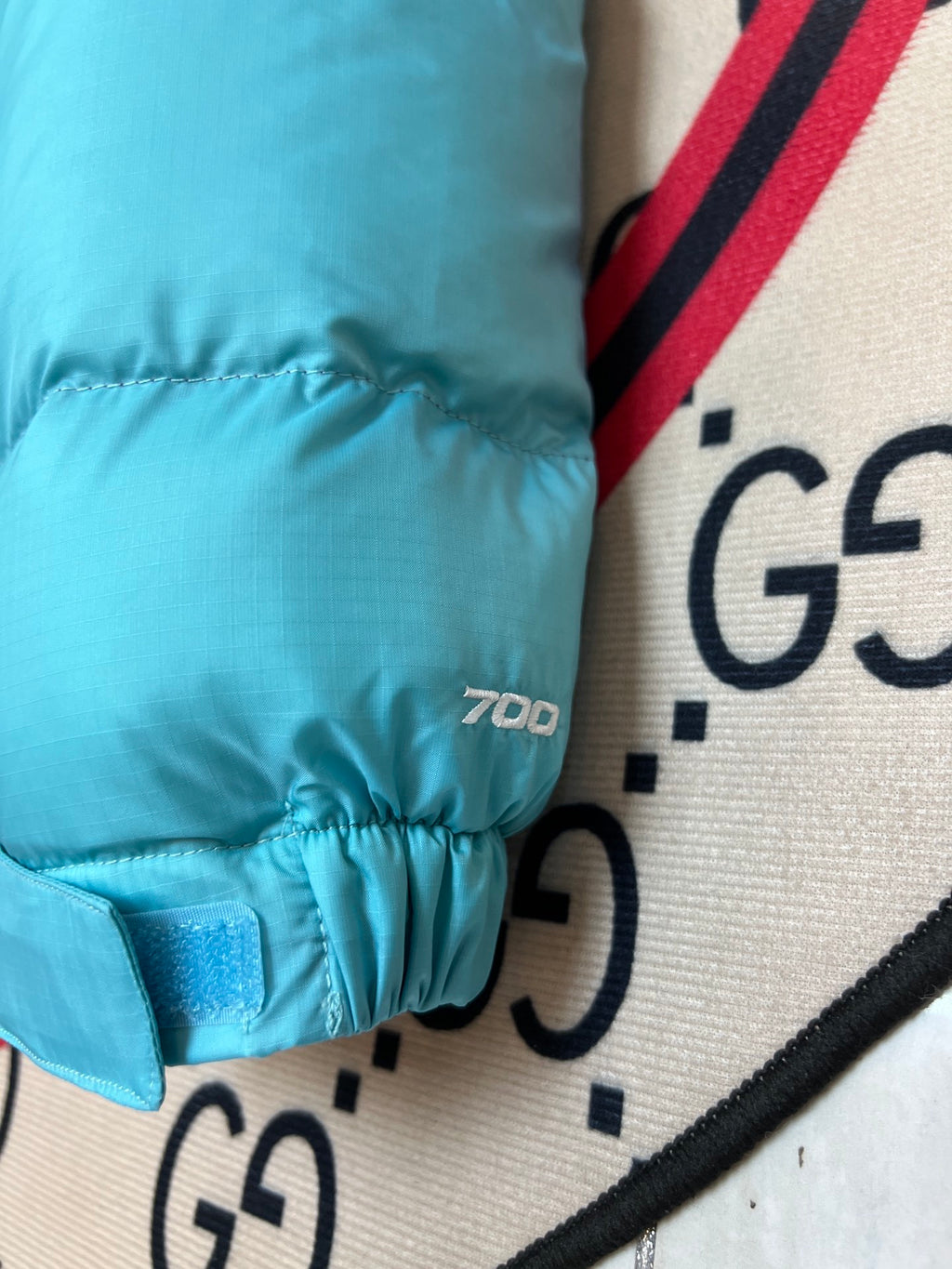 The North Face Cyan Nuptse 700-Fill Down Jacket with Purple Interior